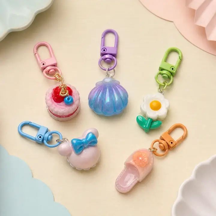 Finished pastel cake, shell, flower, bow, and slipper keychains